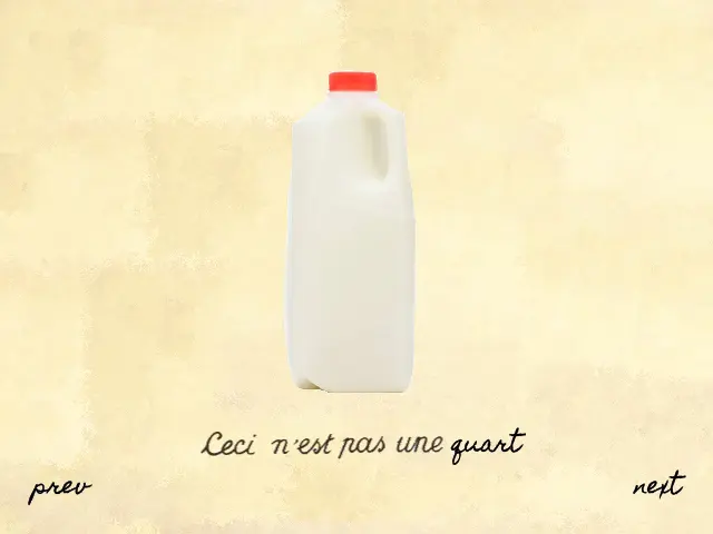 A screenshot of a video game. A quart of milk with a red cap sits on a yellow, paper canvas. Below it is the text from René Magritte's painting "Treachery of Images", with more text added on. It reads, "Ceci n'est pas une quart". Two buttons, reading "prev" and "next" sit in the bottom corners.